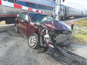 Car hits train on Route 7; no serious injuries