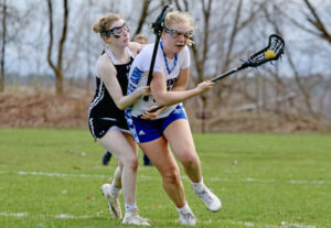 Commodore girls’ lax wins opener then falls to D-I team