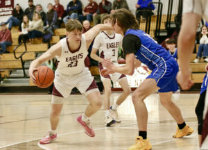 Eagle boys’ hoopsters hold off Milton rally