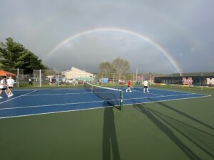 Tiger boys’ tennis splits two