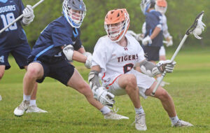 Tiger boys’ lax roars back to OT victory