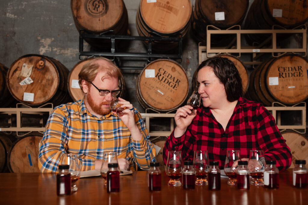 ADAM POLONSKI AND Nora Ganley-Roper sniff whiskey they will blend into a libation sold through Lost Lantern, the couple’s business in Vergennes. They were recently named “drink visionaries” by Food & Wine magazine. Photo by Oliver Parini