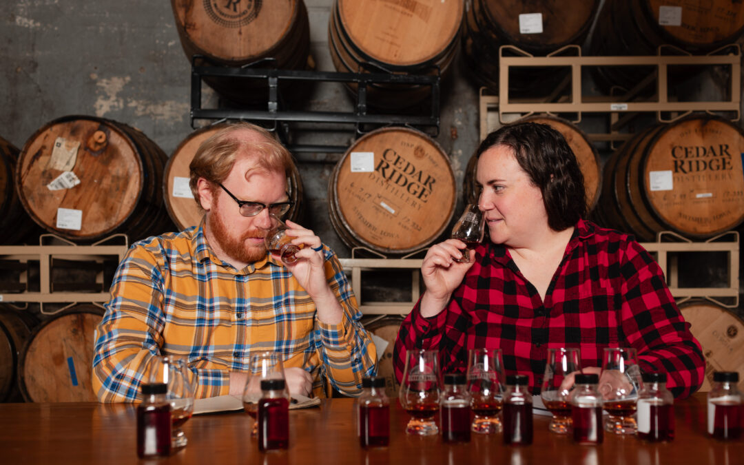 ADAM POLONSKI AND Nora Ganley-Roper sniff whiskey they will blend into a libation sold through Lost Lantern, the couple’s business in Vergennes. They were recently named “drink visionaries” by Food & Wine magazine. Photo by Oliver Parini