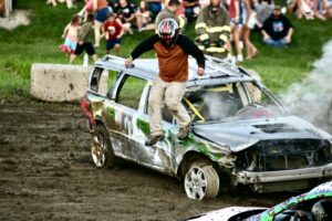 Roaring cars smash and crash in Demolition Derby