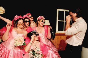 In MCP’s “Five Women Wearing the Same Dress,” one pink monstrosity bonds
