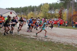 Ripton Ridge racers run under red, orange and yellow leaves